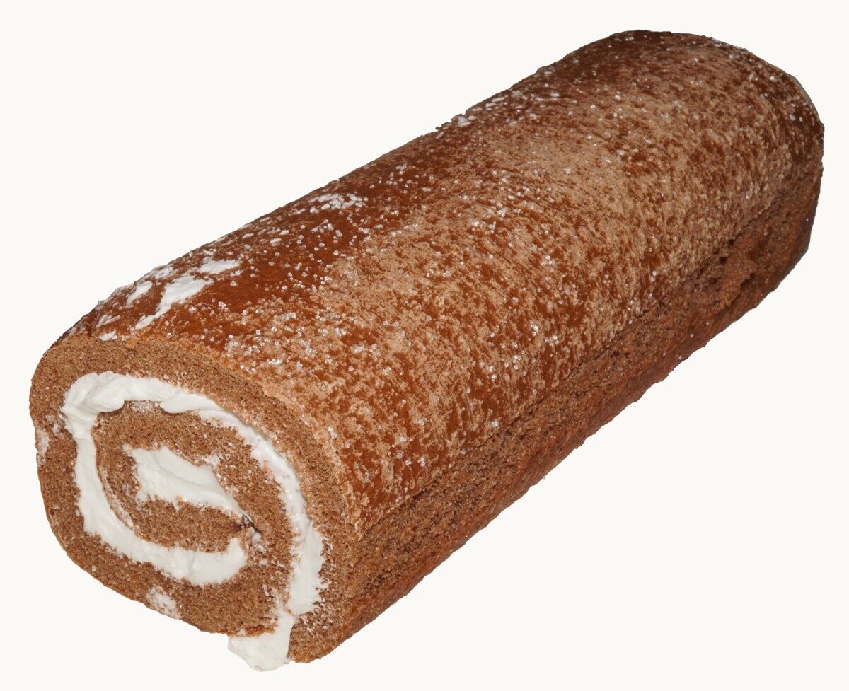 A chocolate Swiss roll cake with the cream spiral visible at its cut end